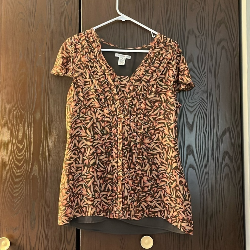 Nine West 100% silk. Brown, dusty rose and peach capped sleeved blouse. Size 14.